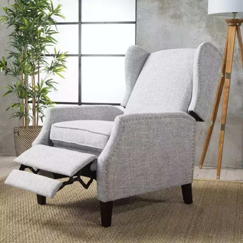 Fauteuil inclinable contemporain en tissu avec oreilles, système push-back et clous décoratifs