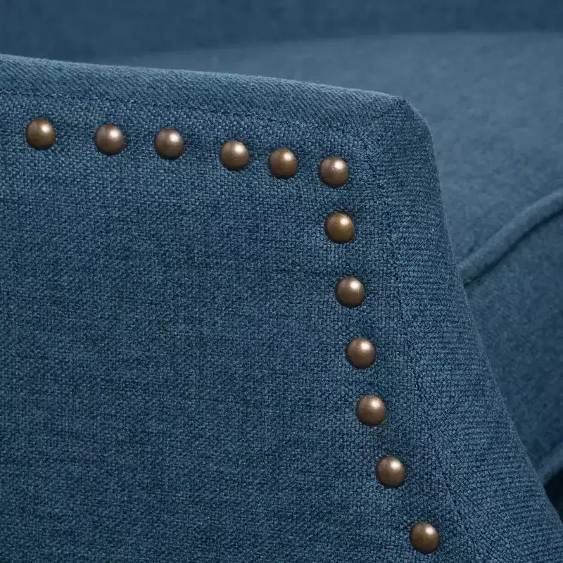 Fauteuil inclinable contemporain en tissu avec oreilles, système push-back et clous décoratifs