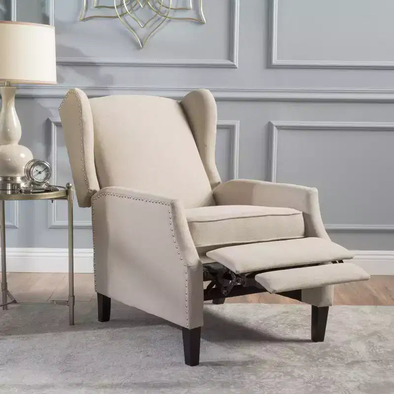 Fauteuil inclinable contemporain en tissu avec oreilles, système push-back et clous décoratifs
